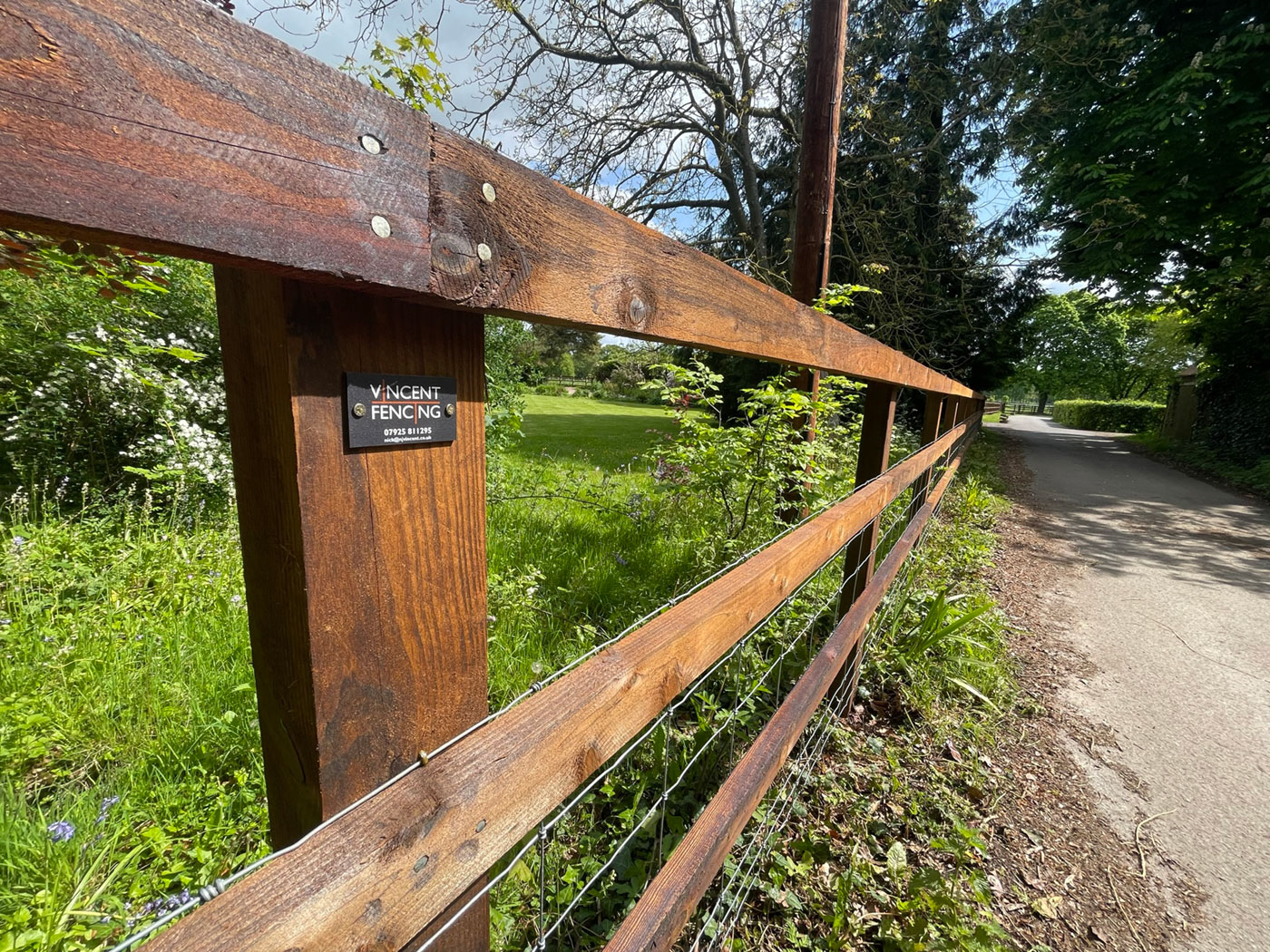 Post and Rail fence with netting by Vincent Fencing